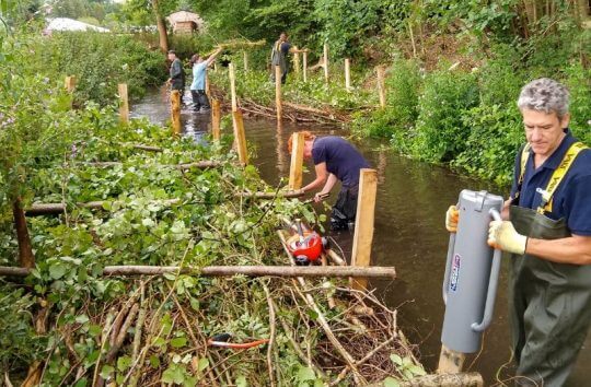 People carrying out river restoration work on the River Chess