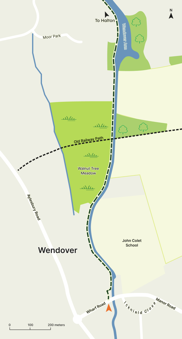 A simple map showing a canal, a path and the surrounding towns and roads.