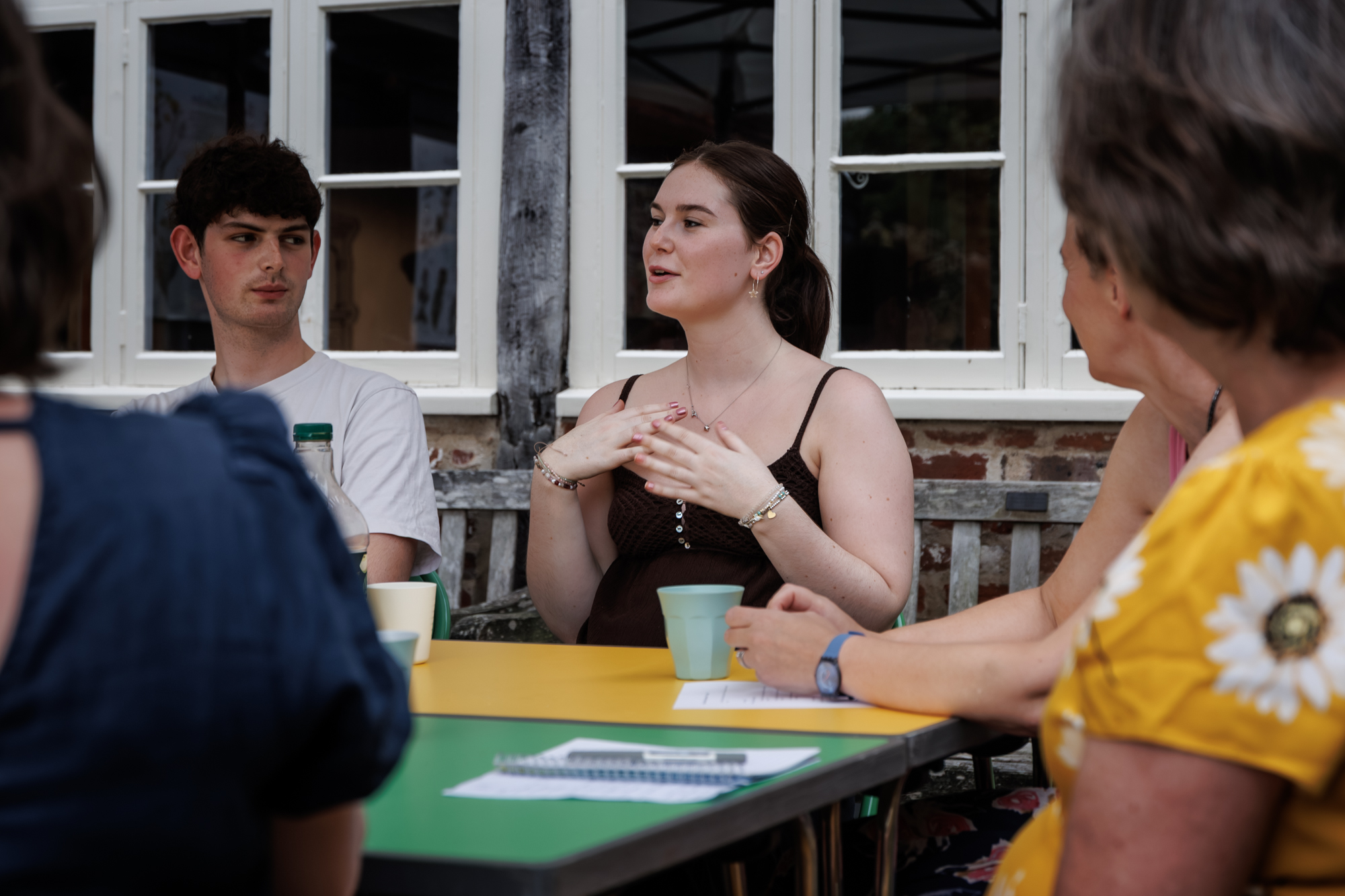 young adults around a meeting table