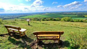 To benches at the top of a hill.