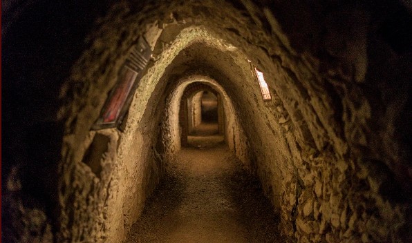 Darkly lit cave tunnel
